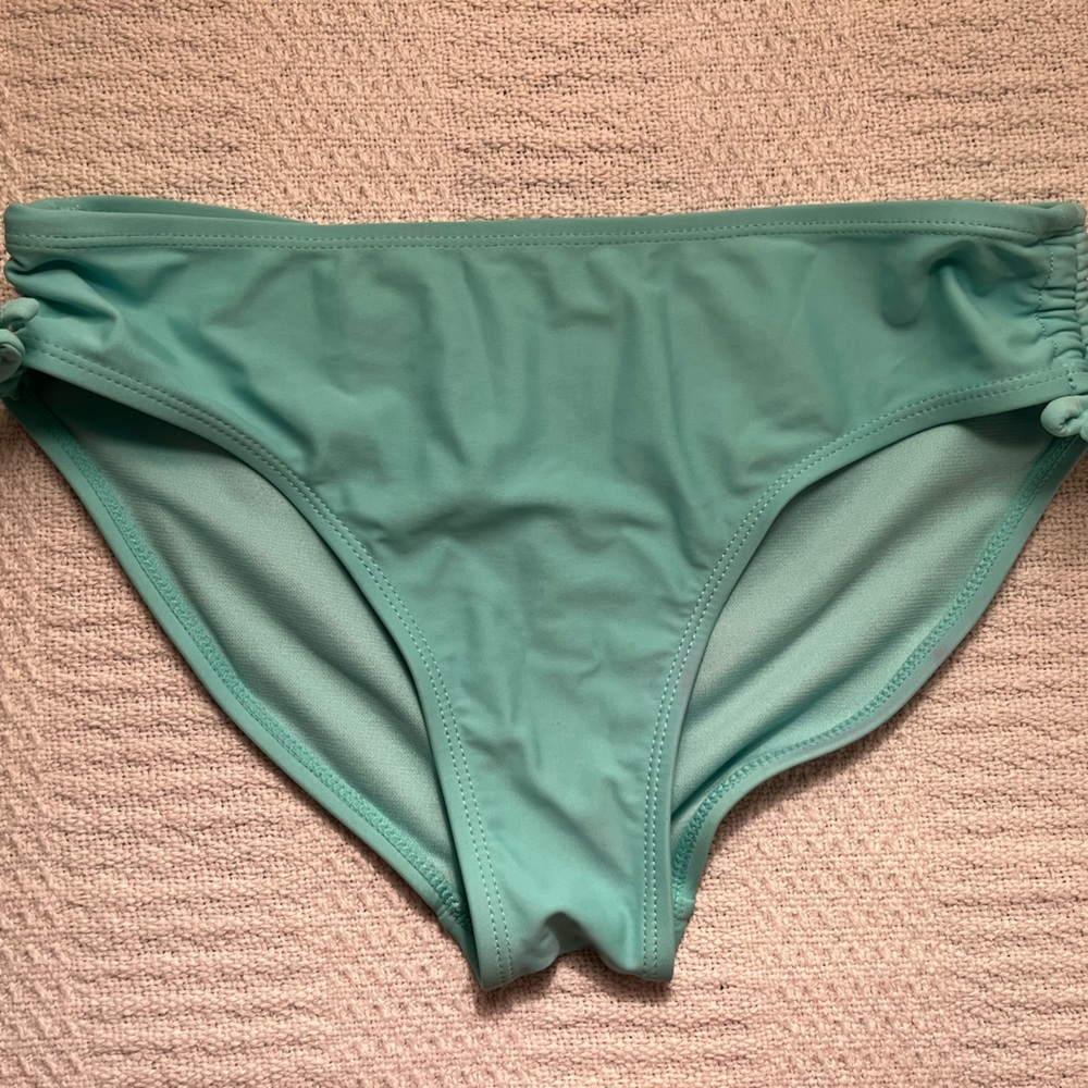 I’m selling blue swimsuit bottoms.
